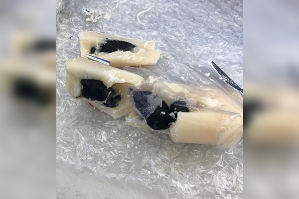 Aseguran cirio que escondía medio kilo de aparente crystal