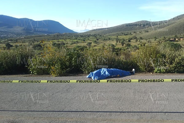 Hallan cadáver de joven asesinado a tiros en la carretera