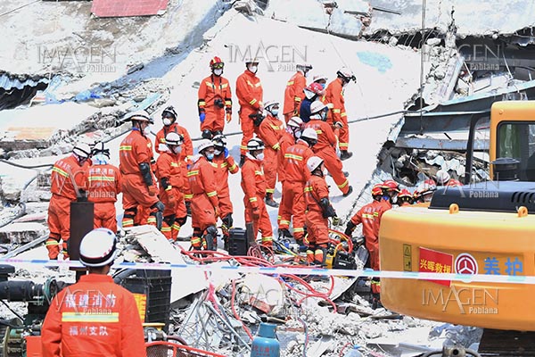 Sube a 13 cifra de muertos tras colapso de hotel en China